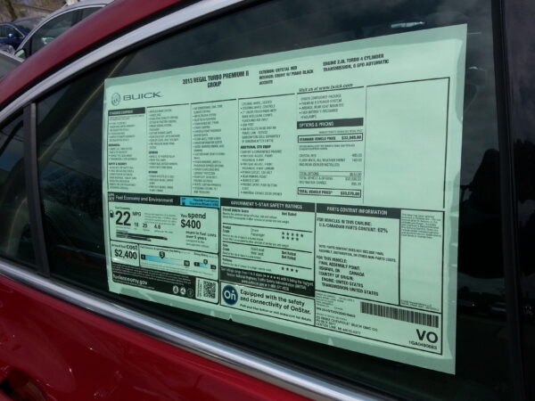 Automotive specs sheet in car window
