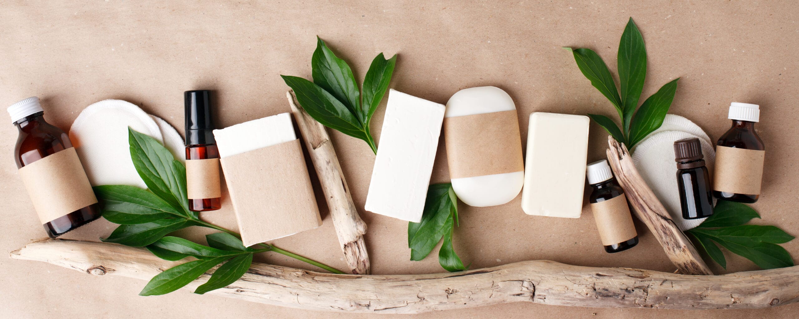 Natural organic cosmetic skincare packaging mock up with leaves and flowers.