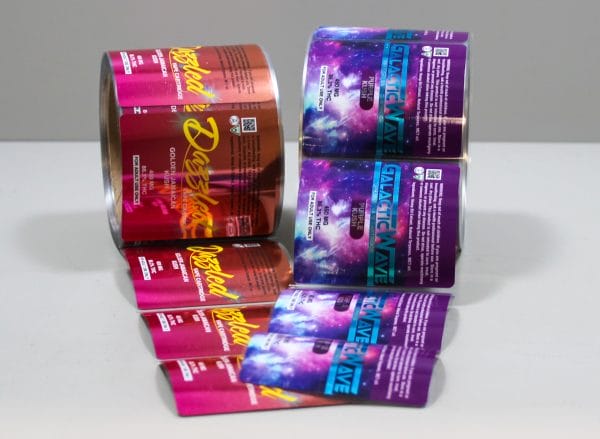 Rolls of Cannabis Labels featuring purple and red designs