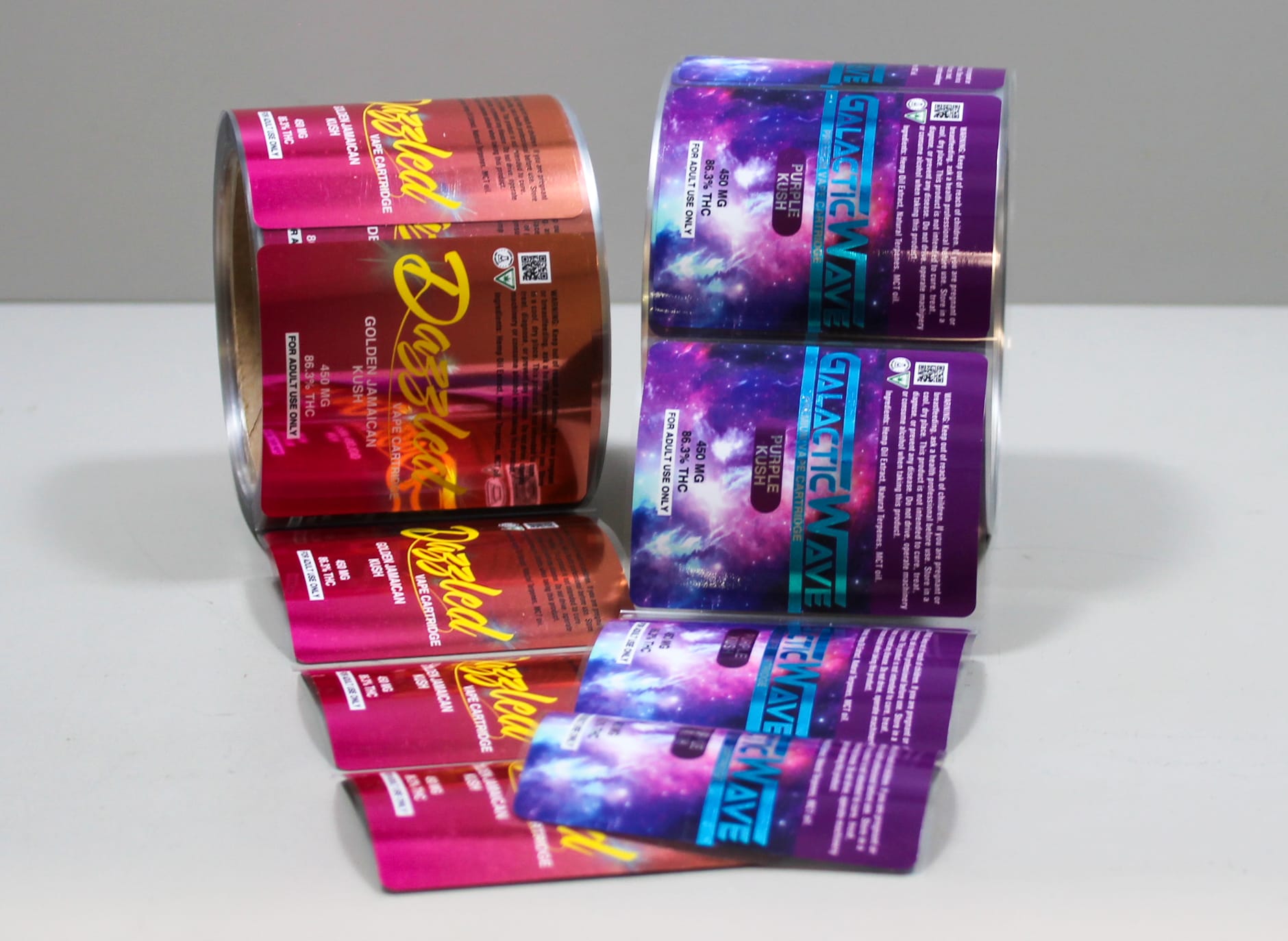 Rolls of Cannabis Labels featuring purple and red designs
