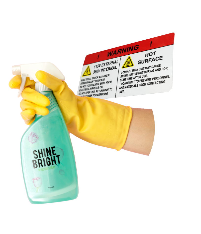 Spray bottle being held by a yellow cleaning glove